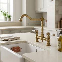 brass-kitchen-faucet-with-white-handles